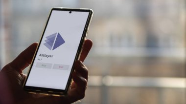 Bir değiş tokuş ekranındaki ALT Altlayer logosuna yaklaş. ALT Altlayer hisse senetleri, bir aygıt üzerinde ALT $.