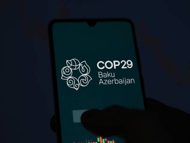 November 16th 2024, logo of COP29 Baku Azerbaijan on a phone in a dark conference room. clipart