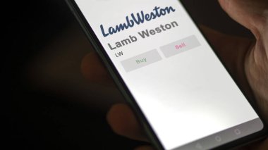 April 09th 2024 , Eagle, Idaho. Close up on logo of Lamb Weston on the screen of an exchange. Lamb Weston price stocks, $LW on a device. clipart