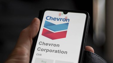 April 09th 2024 , San Ramon, California. Close up on logo of Chevron Corporation on the screen of an exchange. Chevron Corporation price stocks, $CVX on a device. clipart