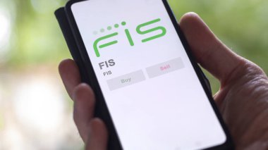 29 Nisan 2024, Jacksonville, Florida. Değiş tokuş ekranındaki FIS logosuna yaklaş. FIS hisse senetleri, cihazdaki FIS $.