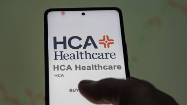 April 09th 2024 , Nashville, Tennessee. Close up on logo of HCA Healthcare on the screen of an exchange. HCA Healthcare price stocks, $HCA on a device. clipart