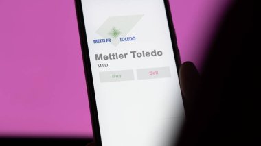 April 09th 2024 , Columbus, Ohio. Close up on logo of Mettler Toledo on the screen of an exchange. Mettler Toledo price stocks, $MTD on a device. clipart