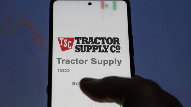 April 09th 2024 , Brentwood, Tennessee. Close up on logo of Tractor Supply on the screen of an exchange. Tractor Supply price stocks, $TSCO on a device. clipart