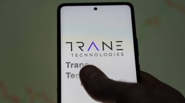 April 09th 2024 , Dublin, Ireland. Close up on logo of Trane Technologies on the screen of an exchange. Trane Technologies price stocks, $TT on a device. clipart