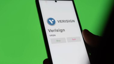 April 09th 2024 , Dulles, Virginia. Close up on logo of Verisign on the screen of an exchange. Verisign price stocks, $VRSN on a device. clipart