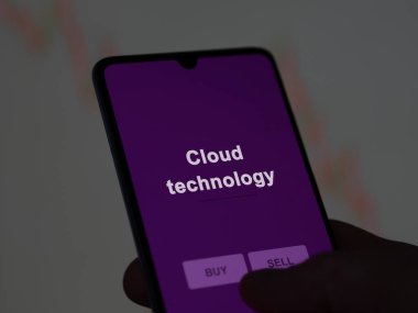 An investor analyzing the cloud technology etf fund on a screen. A phone shows the prices of Cloud technology clipart