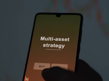 An investor analyzing the multi-asset strategy etf fund on a screen. A phone shows the prices of Multi-asset strategy clipart