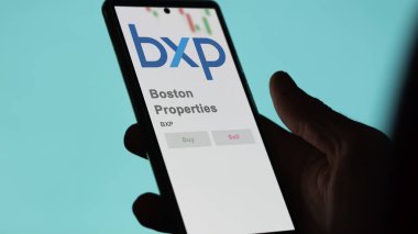 Boston, Massachusetts. Close up on logo of Boston Properties on the screen of an exchange. Boston Properties price stocks, $BXP on a device. clipart