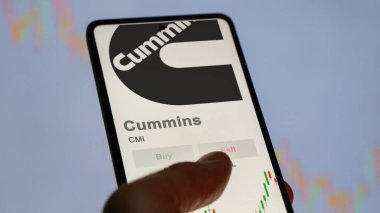 Columbus, Indiana. Close up on logo of Cummins on the screen of an exchange. Cummins price stocks, $CMI on a device. clipart