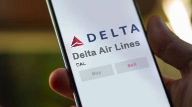 Atlanta, Georgia 'da. Bir değiş tokuş ekranındaki Delta Hava Hatları logosuna yaklaş. Delta Hava Yolları hisse senedi fiyatları, bir aygıt üzerinde DAL $.