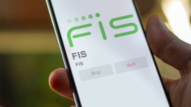 Jacksonville, Florida 'da. Değiş tokuş ekranındaki FIS logosuna yaklaş. FIS hisse senetleri, cihazdaki FIS $.