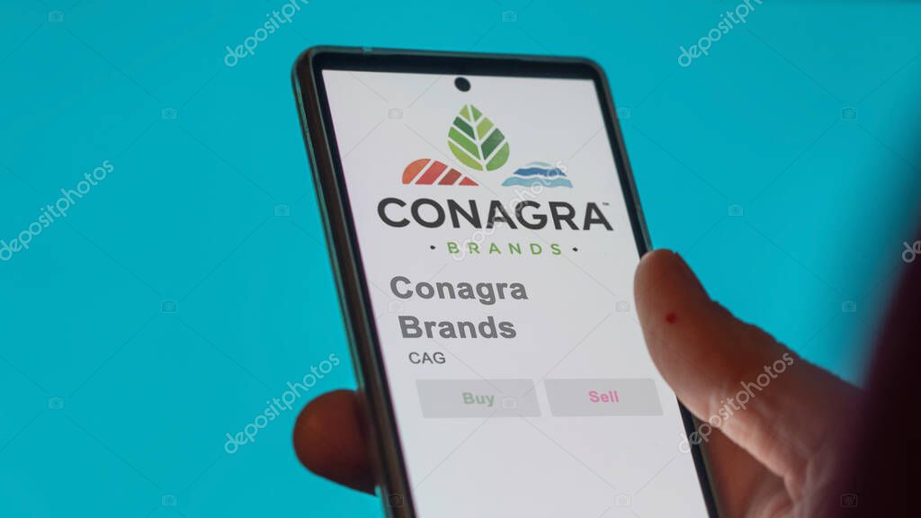 Chicago, Illinois. Close up on logo of Conagra Brands on the screen of an exchange. Conagra Brands price stocks, $CAG on a device.