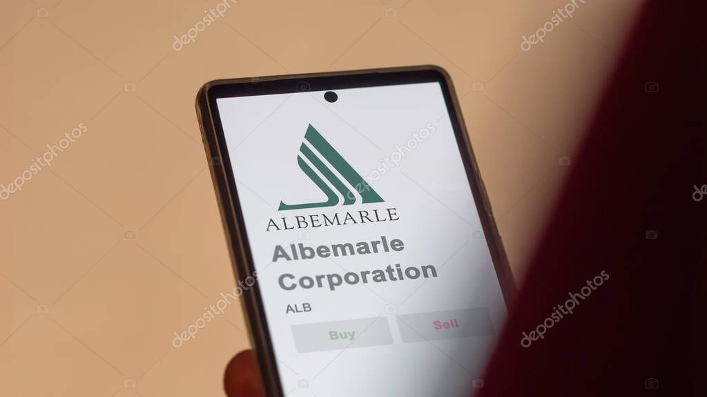 Albemarle Corporation on the screen of an exchange. Albemarle Corporation price stocks, $ALB on a device.