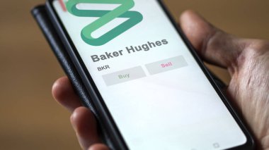 Houston, Teksas. Takas ekranındaki Baker Hughes logosuna yaklaş. Baker Hughes hisse senetleri, bir cihazda BKR $.