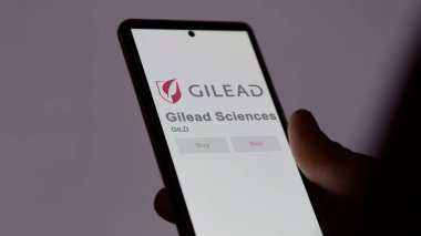 Foster Şehri, Kaliforniya. Gilead Sciences 'ın logosuna bir değiş tokuş ekranında yaklaş. Gilead Sciences hisse senetleri, GILD $bir aygıt üzerinde.