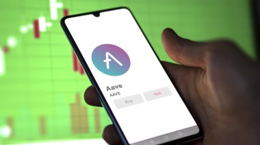 Bir değiş tokuş ekranındaki AVE AVE kripto varlığının logosuna yaklaş. AVE AVE fiyat hisseleri, bir aygıt üzerinde $AVE.