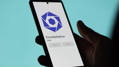 Takas ekranındaki DAG Takımyıldızı Kripto varlığının logosuna yaklaş. DAG Takımyıldızı fiyat hisseleri, DAG $bir aygıt üzerinde.