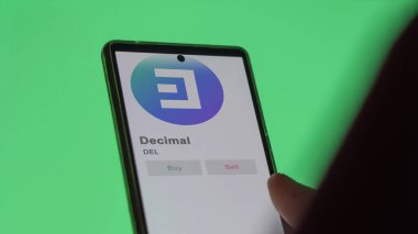 Bir değiş tokuş ekranındaki DEL Ondalık Kripto varlığının logosuna yaklaş. DEL Ondalık Fiyat hisseleri, bir aygıt üzerinde DEL $.