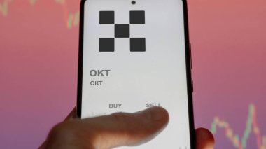 Takas ekranındaki OKT OKT şifreleme varlığının logosuna yaklaş. Tamam OKT fiyat hisseleri, bir aygıt için $OKT.