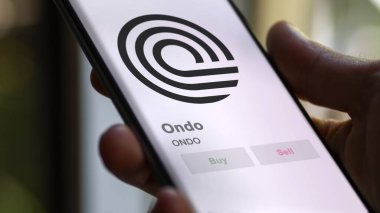 Bir değiş tokuş ekranındaki ONDO Ondo şifreleme varlığının logosunu kapat. ONDO Ondo fiyat hisseleri, bir aygıt üzerinde ONDO $.