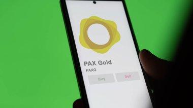 Takas ekranındaki PAXG Pax Gold kripto varlığının logosuna yaklaş. PaXG Pax Altın Fiyat Hisseleri, Bir aygıta PaXG $.