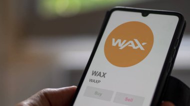 WAXP WAX şifreleme varlığının logosunu bir takas ekranında kapat. WAXP WaX hisse senetleri, bir aygıta WAXP $.