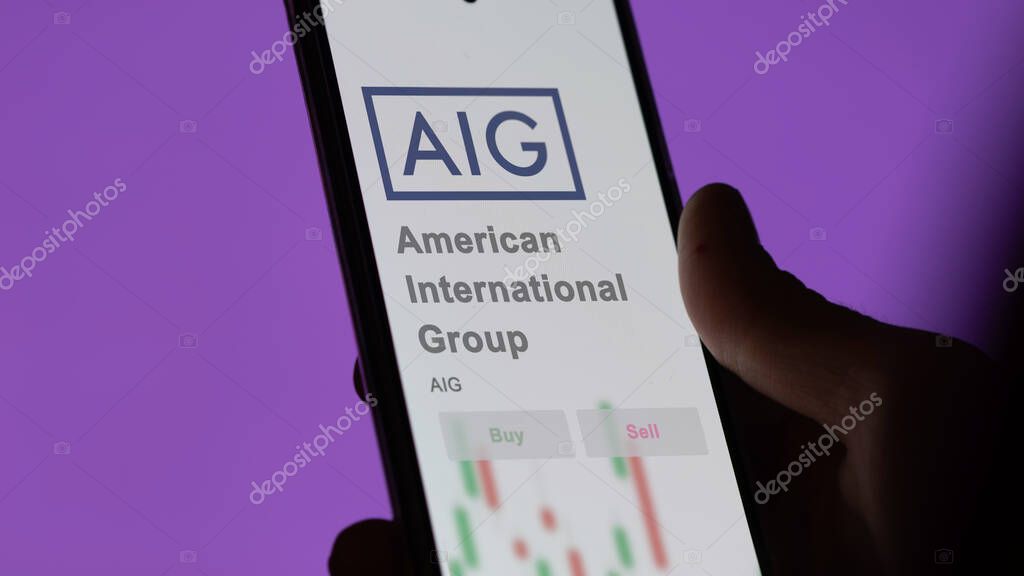 New York City, New York. Close up on logo of American International Group on the screen of an exchange. American International Group price stocks, $AIG on a device.
