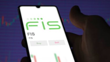 Jacksonville, Florida 'da. Değiş tokuş ekranındaki FIS logosuna yaklaş. FIS hisse senetleri, cihazdaki FIS $.