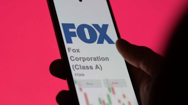 New York, New York. Fox Corporation 'ın (A sınıfı) logosuna bir takas ekranında yaklaş. Fox Corporation (A sınıfı) hisse senetleri, bir cihaza FOXA $.