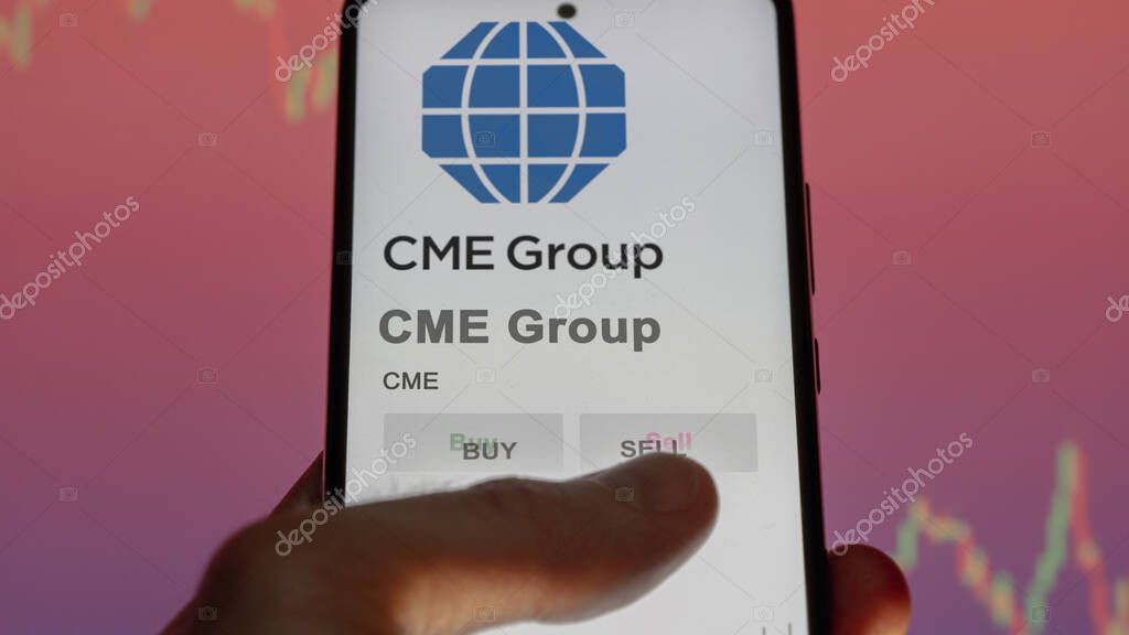 Chicago, Illinois. Close up on logo of CME Group on the screen of an exchange. CME Group price stocks, $CME on a device.