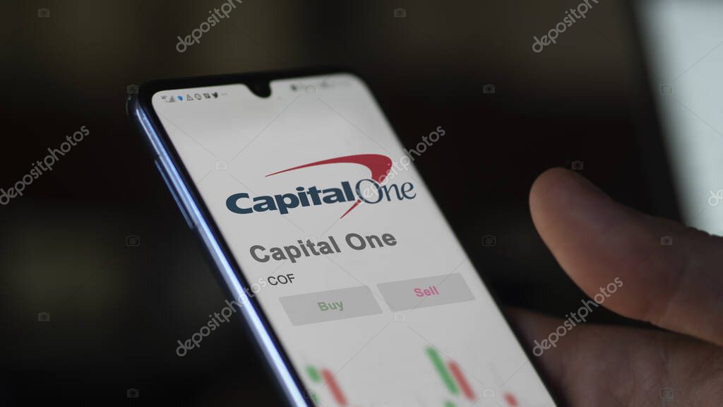 Tysons Corner, Virginia. Close up on logo of Capital One on the screen of an exchange. Capital One price stocks, $COF on a device.