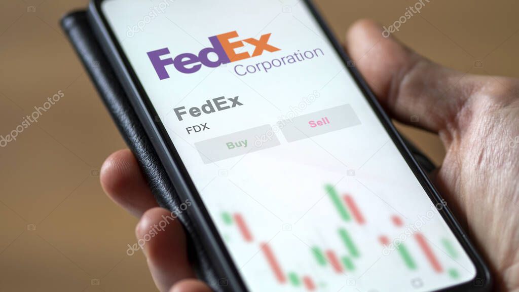 Memphis, Tennessee. Close up on logo of FedEx on the screen of an exchange. FedEx price stocks, $FDX on a device.