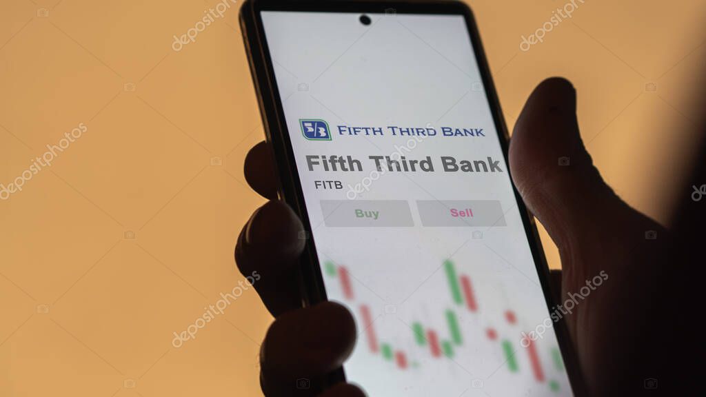 Cincinnati, Ohio. Close up on logo of Fifth Third Bank on the screen of an exchange. Fifth Third Bank price stocks, $FITB on a device.