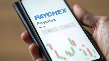 Penfield, New York 'ta. Takas ekranındaki Paychex logosuna yaklaş. Paychex hisse senetleri, cihaz başına $PaYX.
