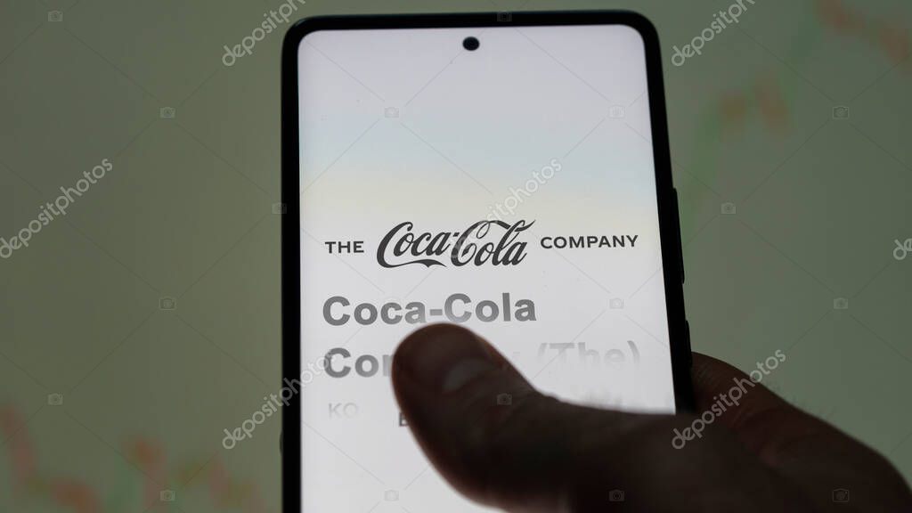 Atlanta, Georgia. Close up on logo of Coca-Cola Company (The) on the screen of an exchange. Coca-Cola Company (The) price stocks, $KO on a device.