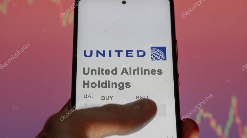 Chicago, Illinois. Close up on logo of United Airlines Holdings on the screen of an exchange. United Airlines Holdings price stocks, $UAL on a device.