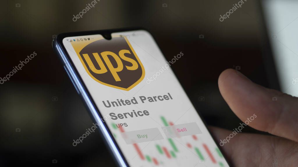 Sandy Springs, Georgia. Close up on logo of United Parcel Service on the screen of an exchange. United Parcel Service price stocks, $UPS on a device.