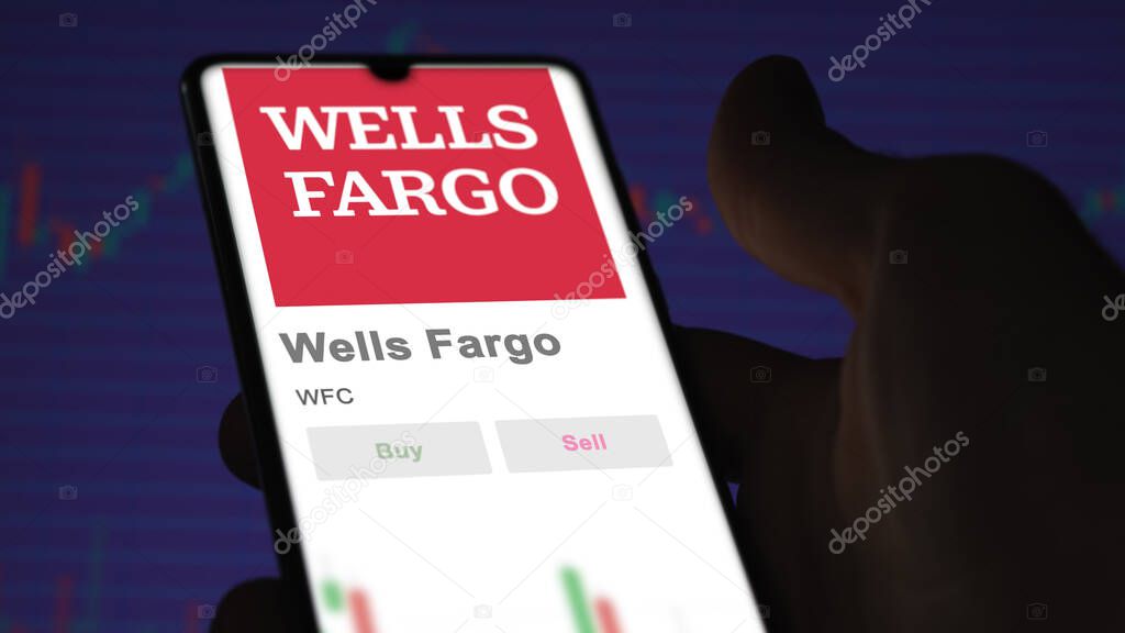 San Francisco, California. Close up on logo of Wells Fargo on the screen of an exchange. Wells Fargo price stocks, $WFC on a device.