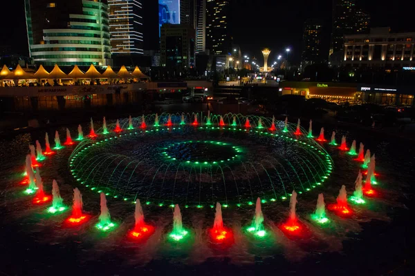 stock image Astana, Kazakhstan 09.07.2018 : fountain show at night in the center of Astana, Kazakhstan. in the background, the Bayterek Tower is a monument and an observation deck