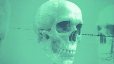 Dönen eski bir film ve tıbbi çizelge tarzı grunge ve dur hareketi efektiyle dönen bir kafatası grafiği