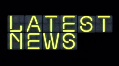 Parlak, sarı, titreyen neon ışıklı harfli neon renkli bir son dakika haberi.. 