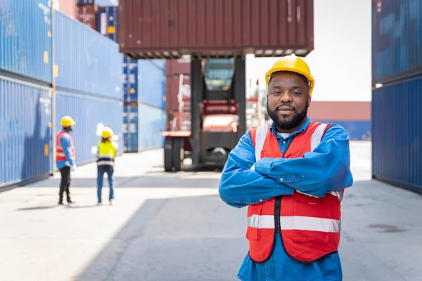 stock image male engineers in a container shipping company Consulting to check the order for the container that is responsible