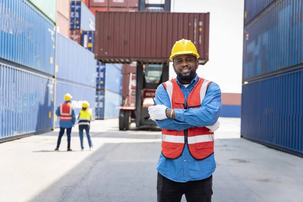 stock image male engineers in a container shipping company Consulting to check the order for the container that is responsible