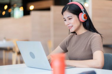 Young students researching inventions with modern technology in university libraries.	