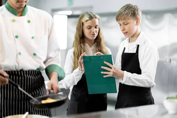 Students are learning to cook in a culinary institute with a standard kitchen and complete equipment. And have a professional chef as a trainer.