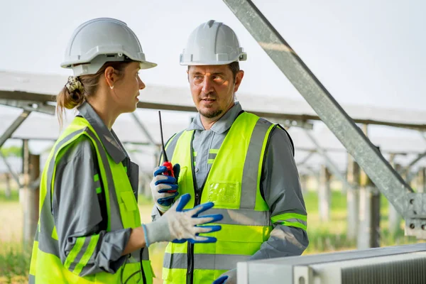 Electrical engineer on solar farm with large structure Check maintain rehearse damaged parts from use in order to produce electricity with maximum efficiency throughout its service life professionally