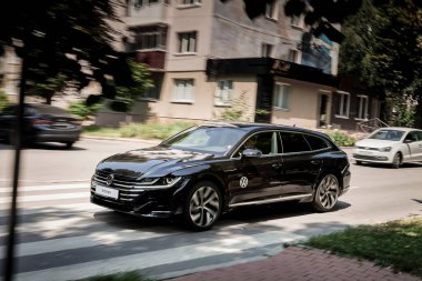 Vinnitsya, Ukraine - 14 July, 2022: Black Volkswagen Arteon R-Line car moving on the street