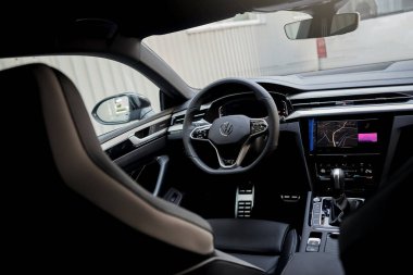 Vinnitsya, Ukraine - 14 July, 2022: Black Volkswagen Arteon R-Line interior and steering wheel