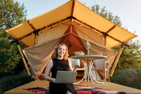 Happy Woman Freelancer Using Laptop Drink Coffee Cozy Glamping Tent Stock Picture